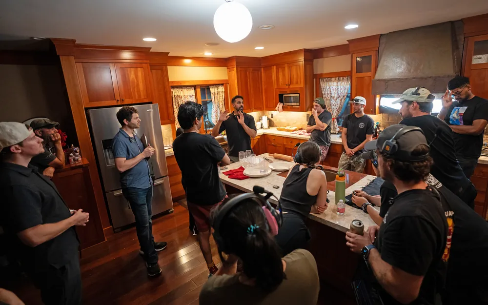 Sunny addressing the crew on set